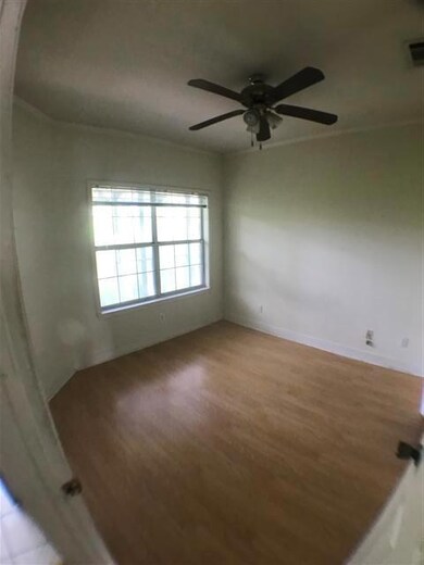 Unfurnished room featuring wood finished floors, 