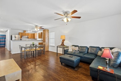 Living area with wood finished floors, baseboards