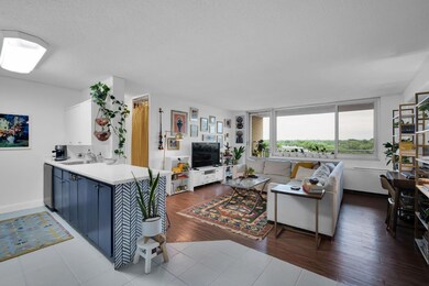 Living room featuring a textured ceiling, sink, an