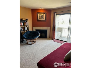 living room with fireplace and patio