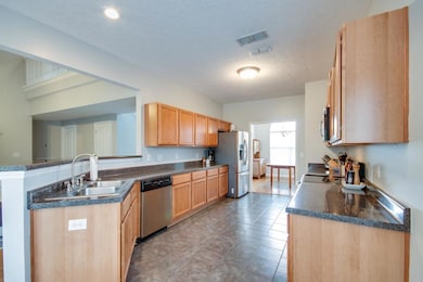 Very Spacious Kitchen with tons of cabinets plus a pantry! Nice and open to the living Room!