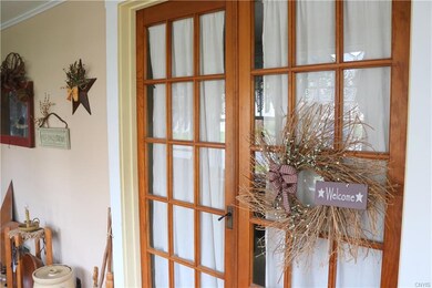 Doors from the enclosed porch that lead into the l