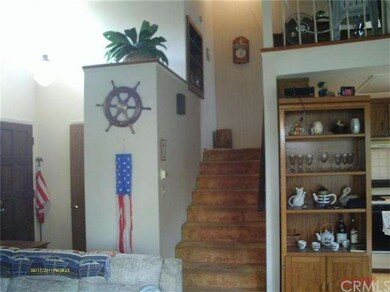 Stairs to upstairs bedroom, bathroom and loft.