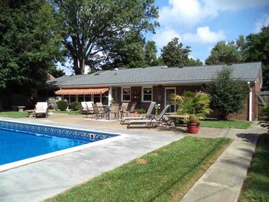 THE BACK OF THE HOUSE OFFERS A GORGEOUS POOL WITH 