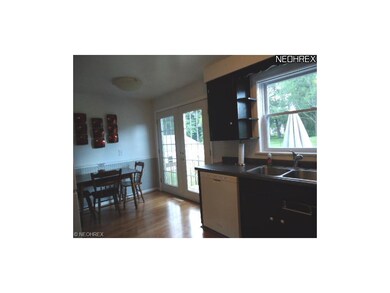 This eat-in Kitchen with laminate floor was painte