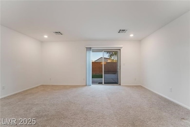 Spare room featuring light colored carpet and rece