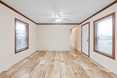 Bright living room showcasing the warm Caramel trim against the neutral Aztec Natural walls