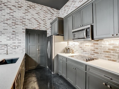 Kitchen featuring appliances with stainless steel 