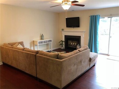 Living Room with wood burning fireplace, and acces