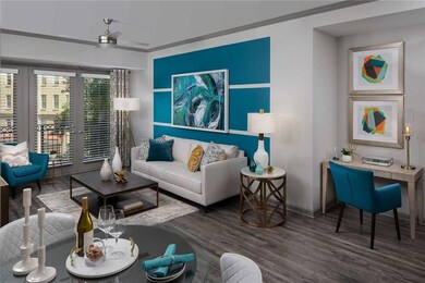Living room with ceiling fan, crown molding, and h