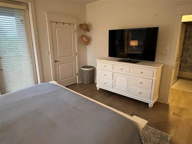 Bedroom with wood finished floors