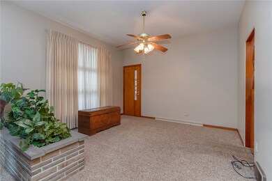 Formal dining room another large window and a door