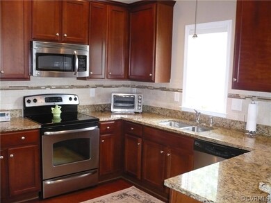 Kitchen with custom cabinetry, granite countertops