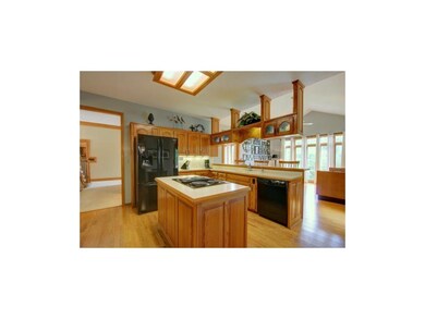 Kitchen laminate floors, island and ample cabinet 