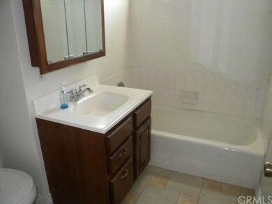 FRONT BATHROOM. NEW TOILET AND CERAMIC TILE FLOOR.