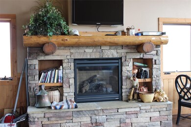 Rock fireplace with propane insert is a focal poin