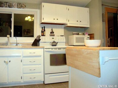 Kitchen. Kitchen appliances and island stay with h