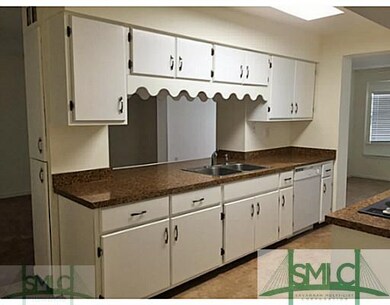Exterior Front. Updated kitchen with wood cabinetr