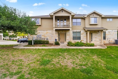 Townhome / multi-family property featuring a balc