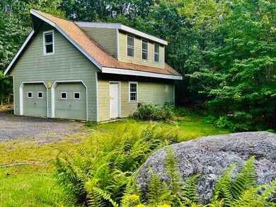 A large two-car garage with space for a workshop o
