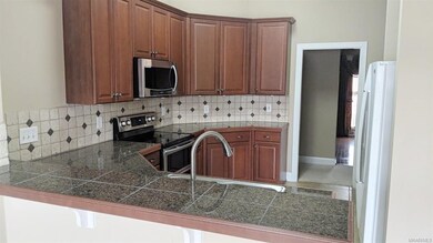 KITCHEN FEATURES GRANITE SQUARE COUNTERTOPS, TILE 