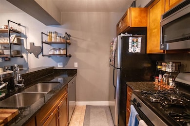 Kitchen featuring appliances with stainless steel