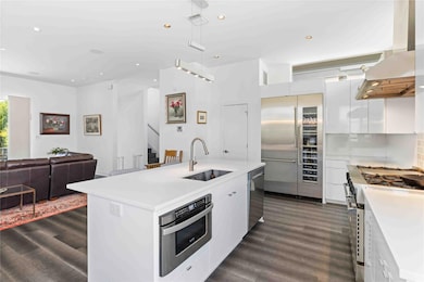 Kitchen with under cabinet range hood, visible ve