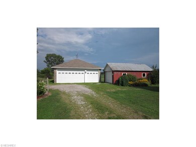 3 Car garage with newer doors plus another garage 