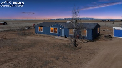 View of front of property with metal roof and fenc