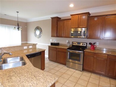 Large kitchen has abundant storage space, work sur