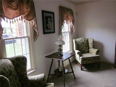 Light filled living room with crown molding