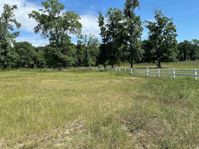 View of yard with a rural view