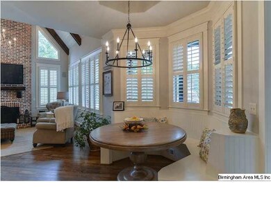 Built in breakfast nook with gorgeous chandelier.