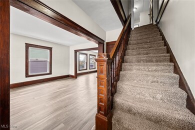 Staircase with hardwood / wood-style floors