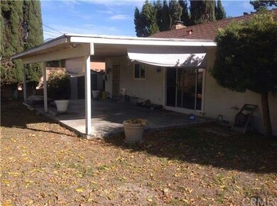 View of the back yard with the covered patio.