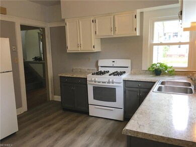 The kitchen has new countertops and flooring. Plenty of cabinet space and nice natural light.