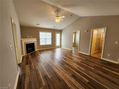 Living Room with vaulted ceilings, gas logs, and new LVP flooring