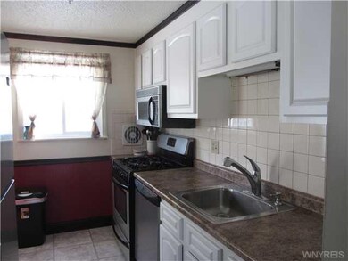 Kitchen. BRIGHT KITCHEN WITH COUNTER NEXT TO FRIDG