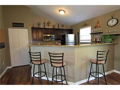 Kitchen. Granite bi-level counters act as breakfas