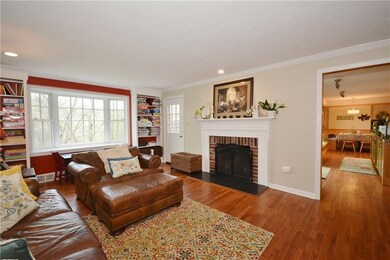 Family room features a fireplace and built in book