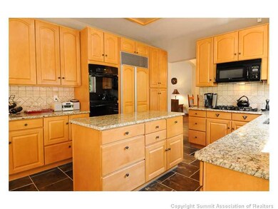 Kitchen. The kitchen is complete with slab granite