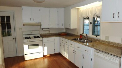 Kitchen with new laminate flooring,...