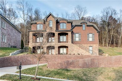 Custom Built with a Full Finished Basement, Covered Double Front Porches, Covered Back Patio, Storage Room, Elevator and More!