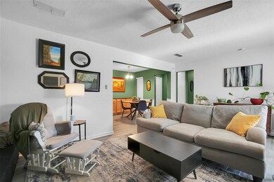 Living room with hardwood / wood-style floors and 