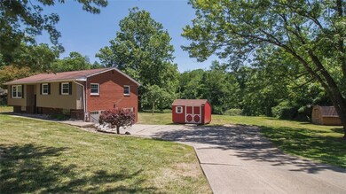 The long driveway leads you to the two car garage