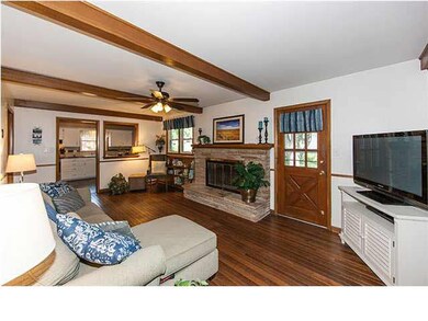 Family room with fireplace & beamed ceilings