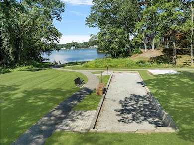 Public bacce court and water access across the str