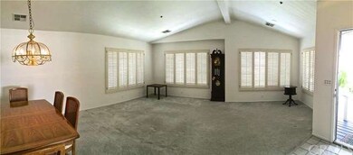 View of the open dining room, living room, and fro