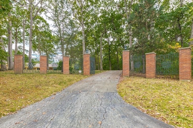 Grand gated entrance to this spectacular 5 acre es