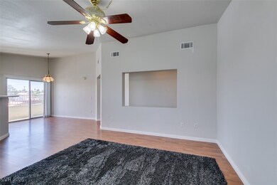 Spare room featuring wood finished floors, visible